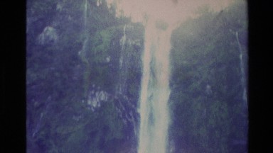 1982: beautiful scenery of a waterfall flowing down from the hills NEW ZEALAND