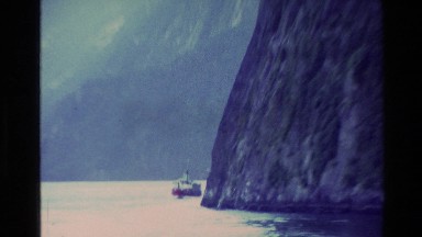 1982: people enjoying the trip with boat,around the mountains NEW ZEALAND