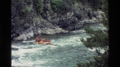 1980: two inflatable boats rafting with many people on a mighty river GRAND
