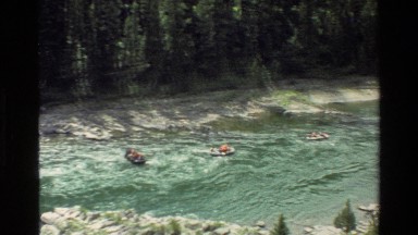1980: people on boats, letting the river current take them away GRAND TETON