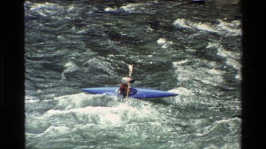 1980: paddling in a kayak through epic waves GRAND TETON WYOMING