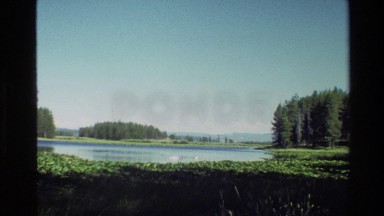 1980: A Lake with Forest and Mountain in the Background GRAND TETON WYOMING