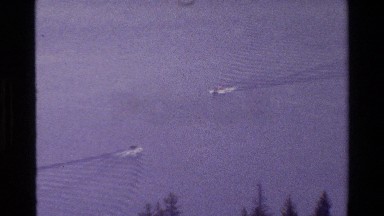1980: unobscured view of a gorgeous tree lined lake in the afternoon GRAND TETON