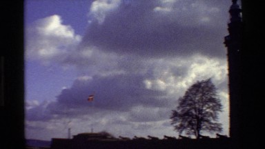 1982: flag of denmark waving outside a old building, by the water DENMARK