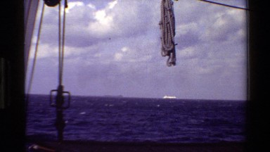 1982: a rope swings on a line on a boat as it sails in the sea DENMARK
