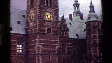 1982: clock tower looking over a old fashioned square DENMARK