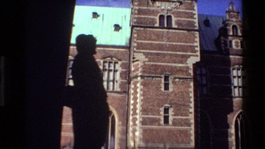 1982: women in archway next to brick clock tower DENMARK