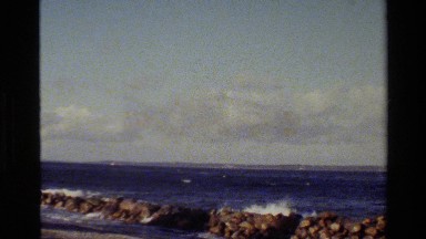 1982: smooth bluish waves and calm and cloudy sky of a day on sea DENMARK