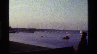 1982: a person looking out over a shipping yard DENMARK