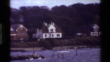 1982: viewing of nice homes in front of a lake. DENMARK