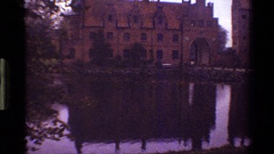 1983: two big buildings as same as a palace with a small lake on the front in