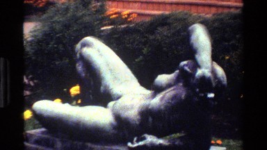 1983: two angle shots of a sculpture of a sorrowed naked woman. DENMARK