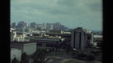 1981: zooming in on a tall white building while viewing other landmarks in the