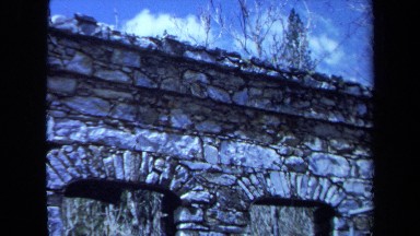 1971: an ancient crumbling incomplete gray stone wall in ruins MAINE