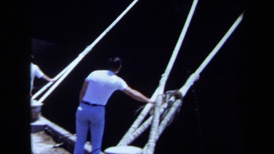 1971: two people holding the rope which is tied for the ship MAINE