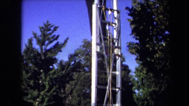 1971: a man climbing on a ladder and taking picture of graduation SACRAMENTO