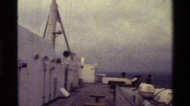 1983: sailors on the deck of a ship in choppy waters. DENMARK