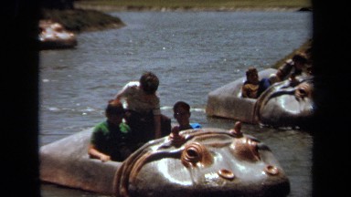 1971: children pedaling hippo boat in water park LAGUNA HILLS CALIFORNIA