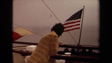 1971: a person watching the flag fly LONG BEACH CALIFORNIA