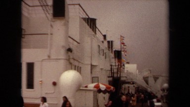 1971: camera pans across the cabin of a large cruise ship