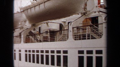 1971: huge ship with lifeboats, flags, decks LONG BEACH CALIFORNIA