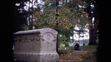 1970: a large gray ornate headstone that reads lincoln