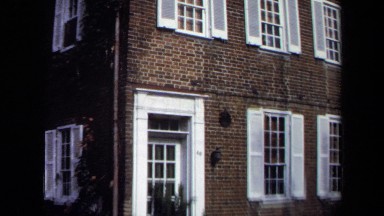 1970: brown bricked house zoom in WASHINGTON DC