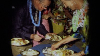 1971: Men and Women Serving Plates at a California Party