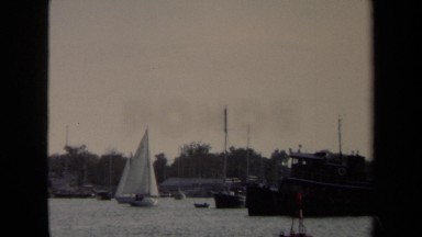 1970: Two Small Sailboats Sailing in Annapolis Harbor