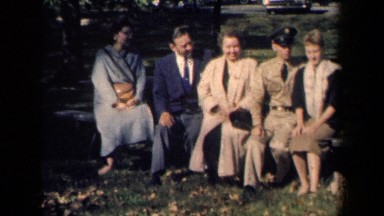 1959: A Group of People Sitting on a Bench and Talking in New York