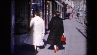 1959: women walking with dresses with a child busy area NEW YORK