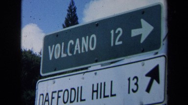1969: Two Traffic Signs Showing Direction and Distance to a Volcano and a Hill