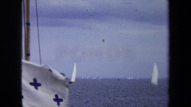 1970: white flag with five blue crosses waves from ship