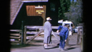 1969: People Walk Toward Wood Building Named Daffodil Hill California