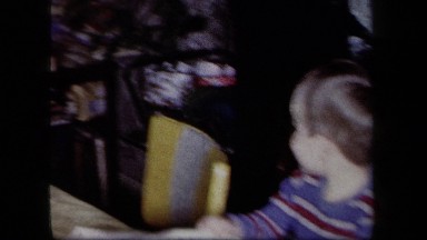 1958: Two Small Boys Reading Magazines with Grandma in New York