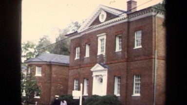 1970: Man and Woman Walking Through a Fancy Neighborhood in Annapolis