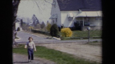 1959: A Young Girl Watching the Camera Then Running Toward It in New York