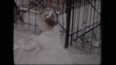 1958: A Little Girl Pushing a Stroller in New York