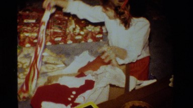 1984: Adolescent Girl Opening Presents in California