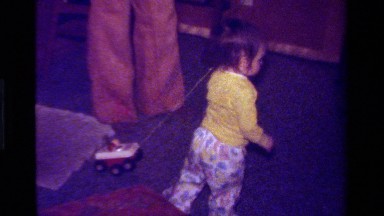 1979: Toddler Drags Toy Truck on String in California Living Room