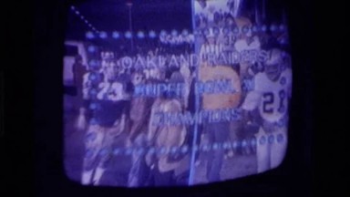 1979: football players being watched on television CALIFORNIA