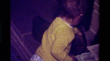 1979: toddler in yellow playing with shoes CALIFORNIA