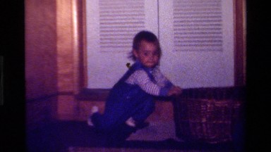 1979: Toddler Stands While Holding Basket California