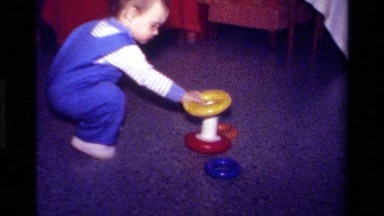 1979: A Toddler Plays on the Floor with an Educational Toy in California