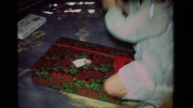 1981: Girl Standing in Room with Toy in Hand, California