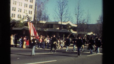 1981: Military Marching in a Parade with the American Flag