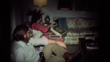 1981: Group of People Sitting on a Couch Opening Presents California