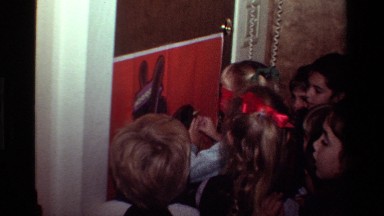 1981: Children Sticking Ribbon on Cartoon Picture in California