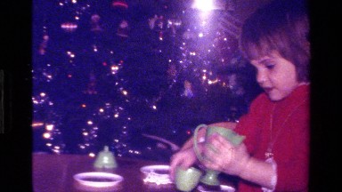 1979: Girl at Christmas Playing with Cup and Teapot California