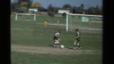 1981: Children Gathered and Playing Football in California